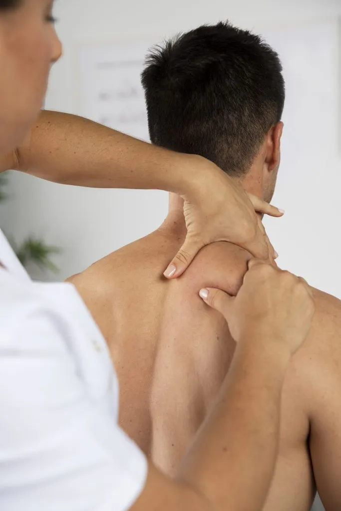 Physiotherapist guiding a patient during rehabilitation